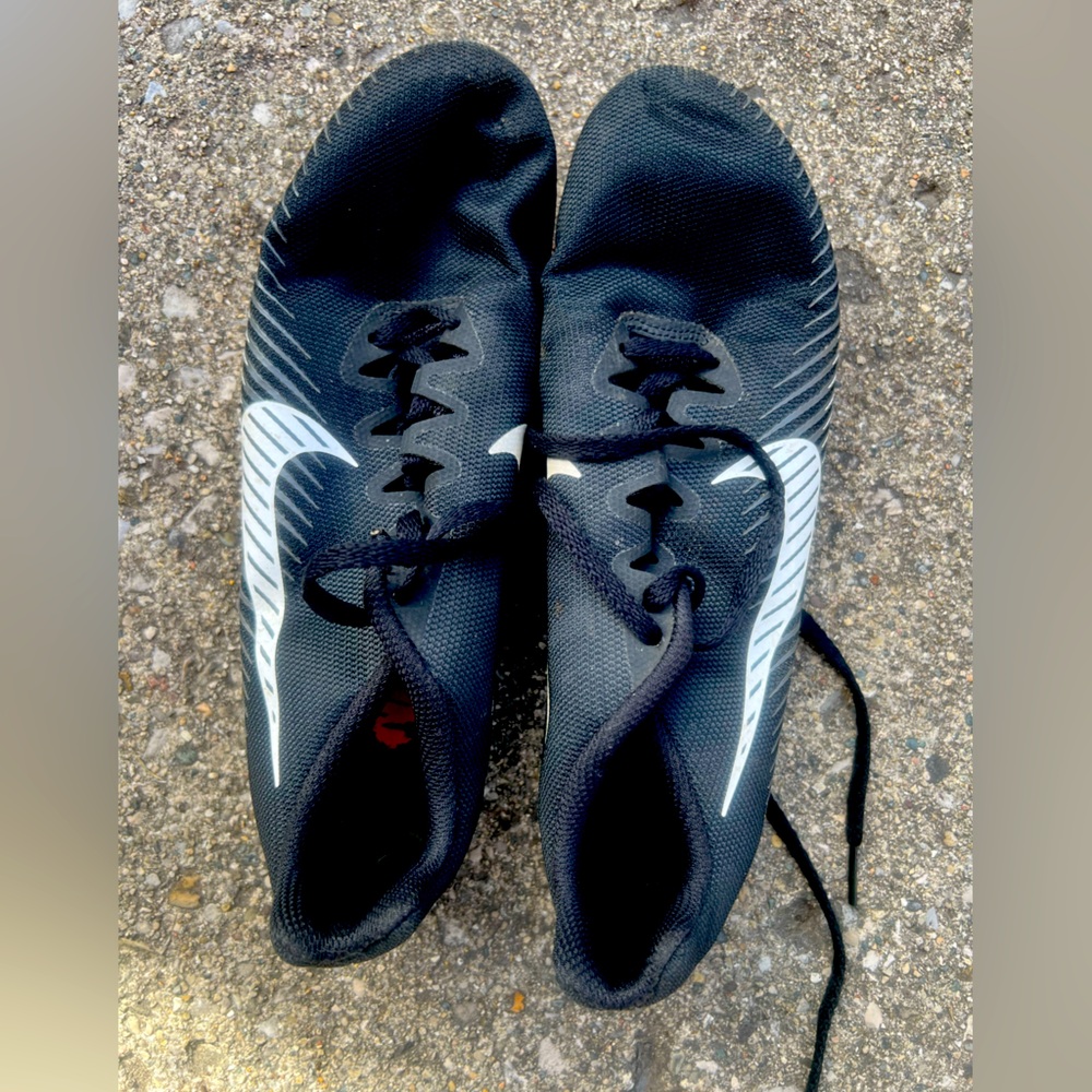 Black Nike sprint shoes